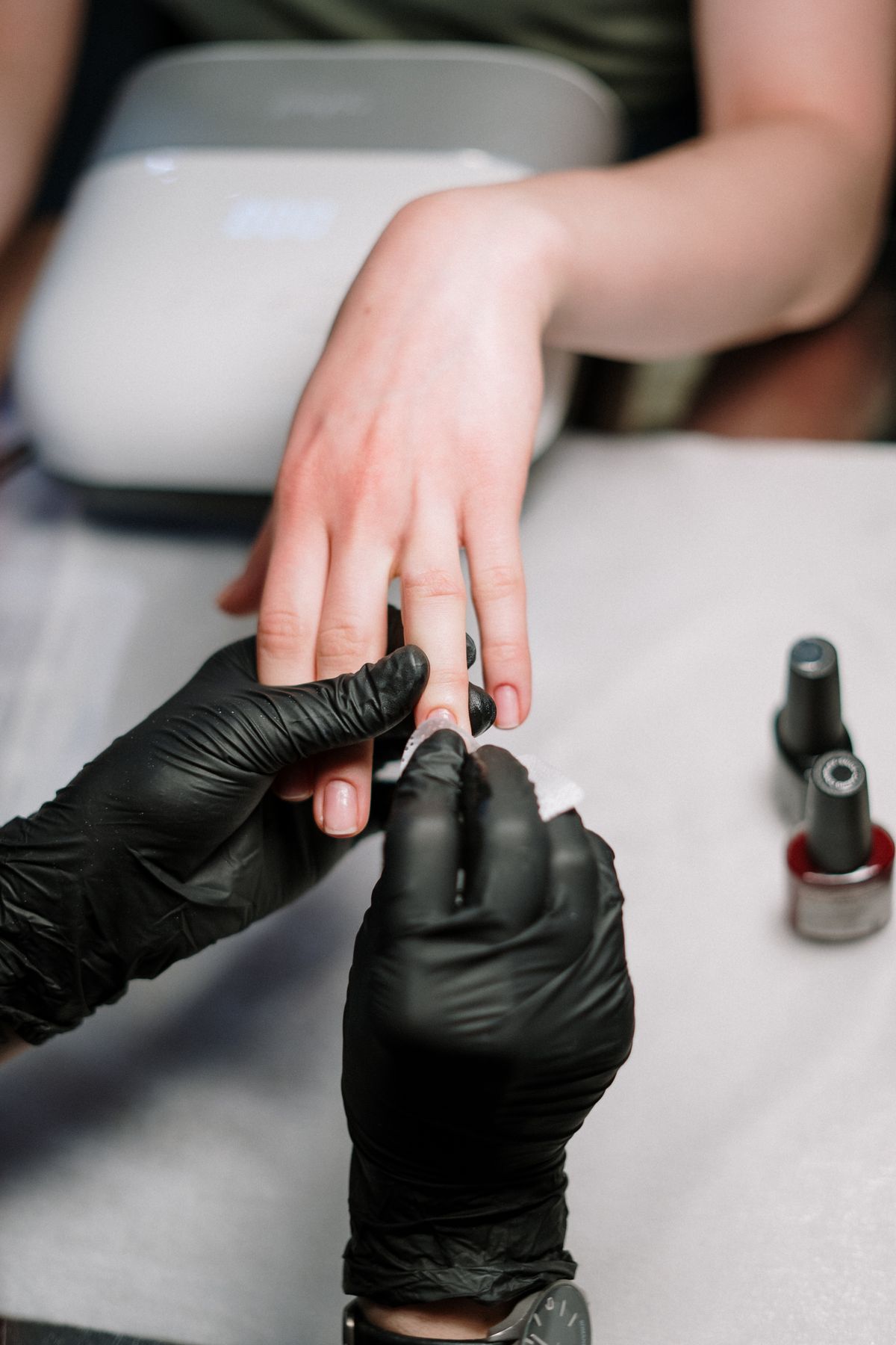 Manicure appointment in progress at a private nail studio